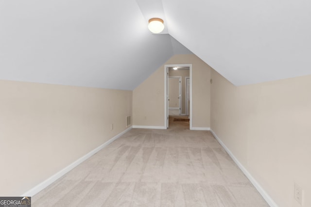 2055 Hickory Station Cir, Snellville, GA 30078 - bonus room with baseboards, vaulted ceiling, light carpet, and visible vents