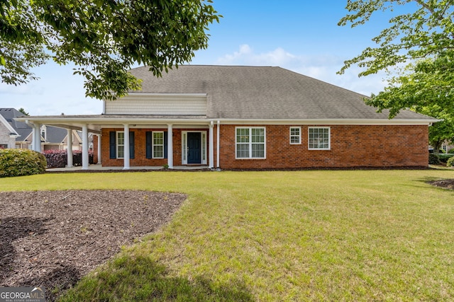 2055 Hickory Station Cir, Snellville, GA 30078 - rear view of property with a lawn, covered porch, roof with shingles, and brick siding