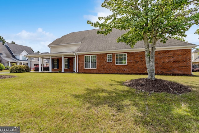 2055 Hickory Station Cir, Snellville, GA 30078 - view of front facade with a shingled roof, a front lawn, and brick siding