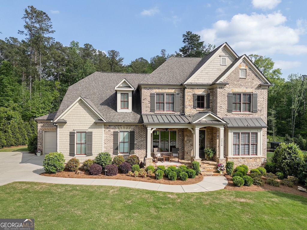 3024 Malbec Vly, Acworth, GA 30101 - craftsman inspired home featuring a porch, a front yard, a garage, and concrete driveway