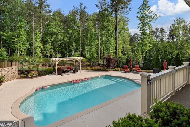 view of swimming pool featuring a pergola, a patio, and fence