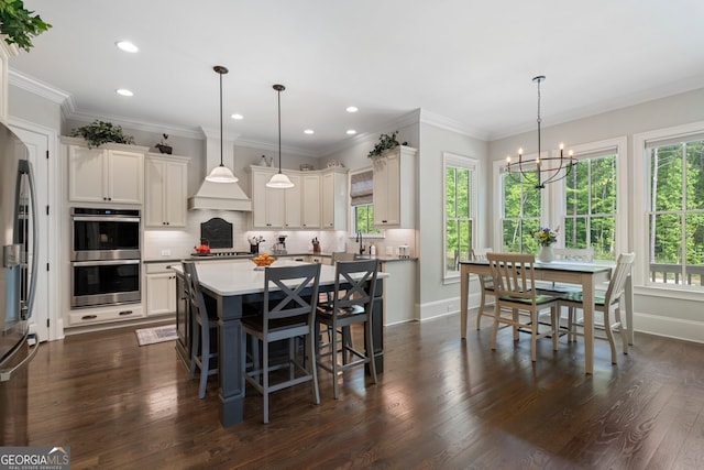 3024 Malbec Vly, Acworth, GA 30101 - dining space with a chandelier, recessed lighting, baseboards, dark wood-style floors, and crown molding