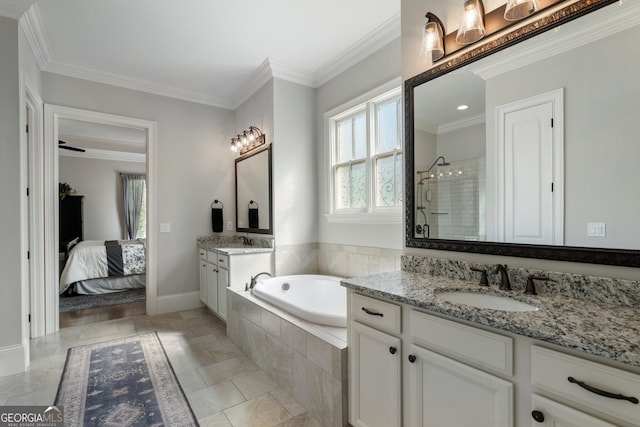 bathroom featuring healthy amount of natural light, a stall shower, a garden tub, ornamental molding, and baseboards