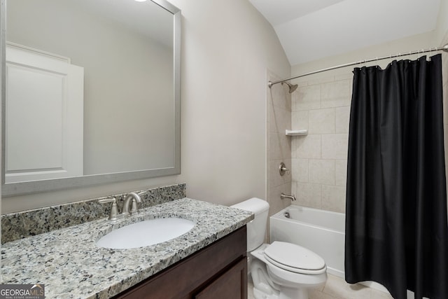 full bath featuring toilet, lofted ceiling, vanity, shower / bath combo, and tile patterned floors