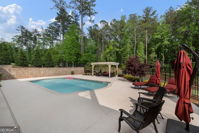 view of swimming pool with a pergola, a patio area, and a fenced backyard