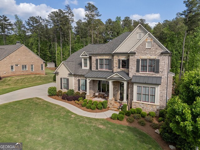 3024 Malbec Vly, Acworth, GA 30101 - craftsman-style home with covered porch, a front yard, roof with shingles, and a standing seam roof