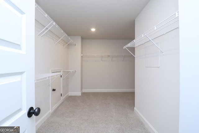 457 Banff Dr, Winder, GA 30680 - walk in closet featuring carpet flooring