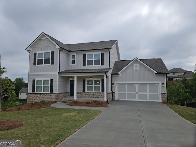457 Banff Dr, Winder, GA 30680 - view of front of house with covered porch, driveway, brick siding, a front yard, and a garage