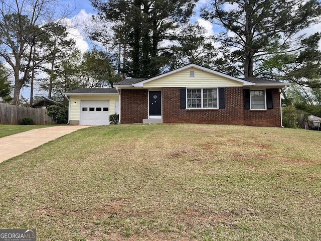 1685 Pheasant Dr, Jonesboro, GA 30238 - single story home featuring fence, an attached garage, brick siding, a front yard, and driveway