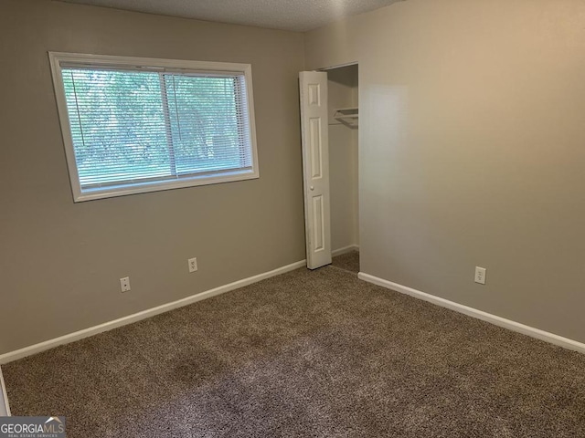 1685 Pheasant Dr, Jonesboro, GA 30238 - unfurnished bedroom with carpet floors, baseboards, and a closet