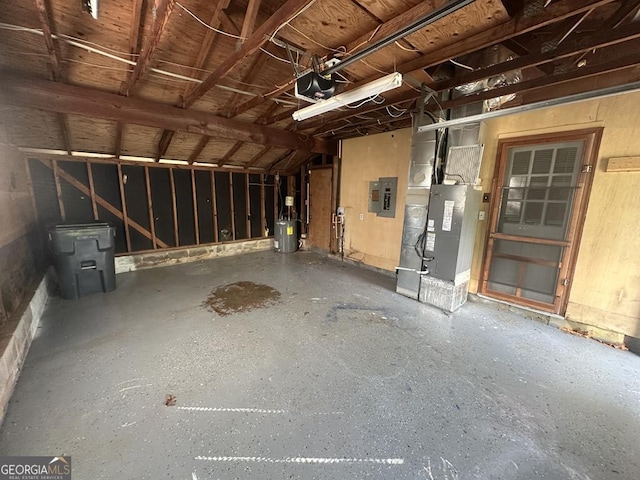 1685 Pheasant Dr, Jonesboro, GA 30238 - garage featuring heating unit, a garage door opener, and electric panel