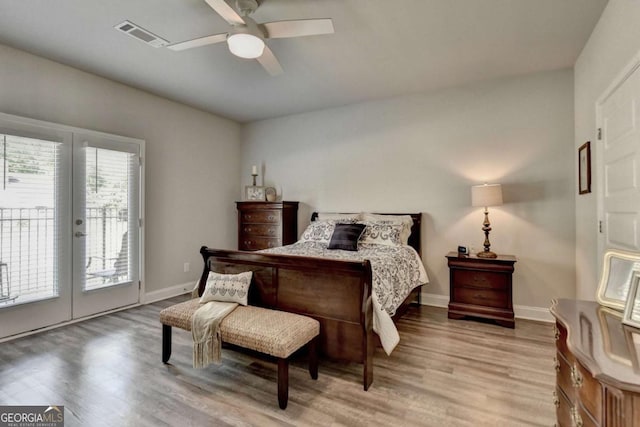 5299 Noble Village Way, Lilburn, GA 30047 - bedroom featuring light wood-style floors, baseboards, visible vents, and access to exterior
