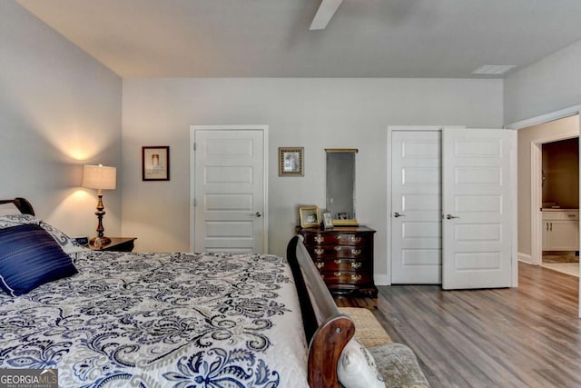 5299 Noble Village Way, Lilburn, GA 30047 - bedroom with visible vents, baseboards, ceiling fan, and wood finished floors