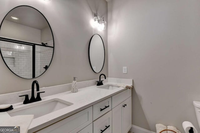 5299 Noble Village Way, Lilburn, GA 30047 - bathroom with double vanity, a sink, toilet, and tiled shower