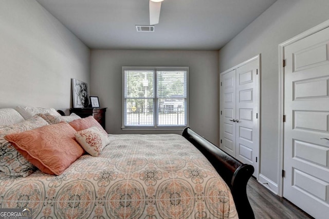 5299 Noble Village Way, Lilburn, GA 30047 - bedroom with visible vents, dark wood-style flooring, and a closet