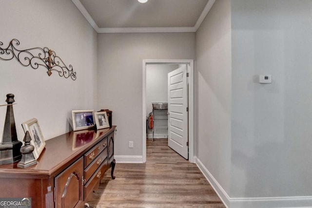 5299 Noble Village Way, Lilburn, GA 30047 - corridor featuring crown molding, baseboards, and wood finished floors