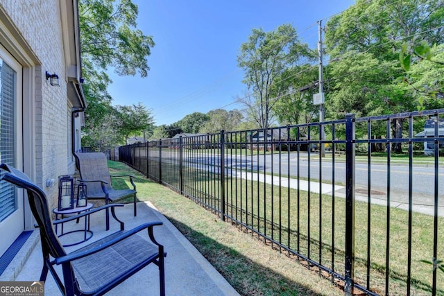 5299 Noble Village Way, Lilburn, GA 30047 - exterior space with a lawn and fence