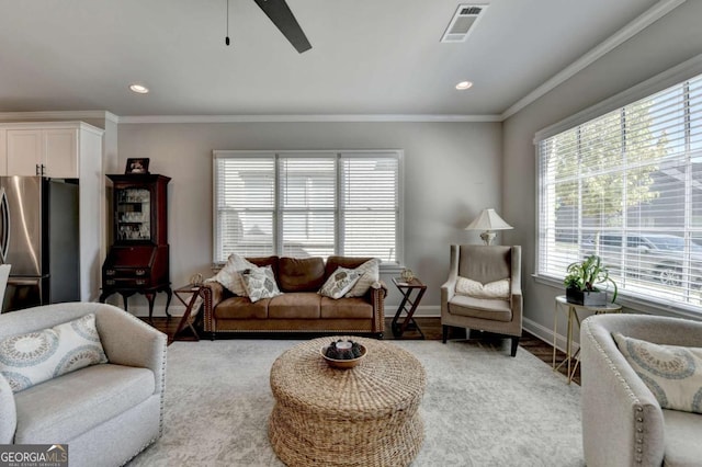 5299 Noble Village Way, Lilburn, GA 30047 - living room featuring visible vents, light wood finished floors, crown molding, and ceiling fan