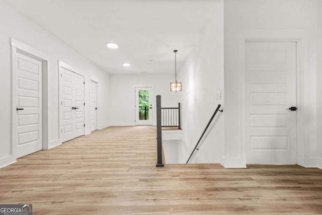 interior space with recessed lighting, baseboards, and light wood-type flooring