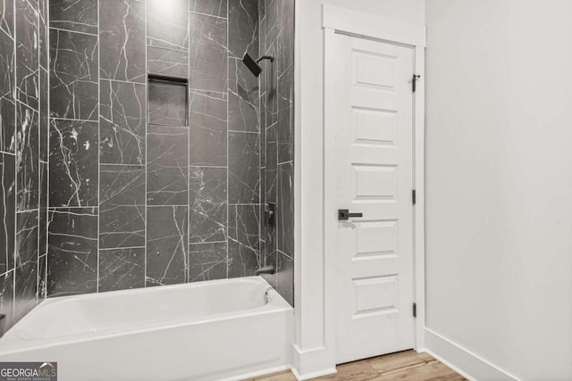 full bath with shower / bathtub combination and wood finished floors