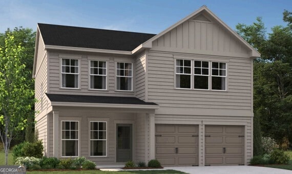 view of front facade with an attached garage, board and batten siding, and concrete driveway