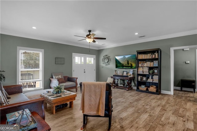 3224 Ware St, Blackshear, GA 31516 - living room with visible vents, crown molding, light wood finished floors, and ceiling fan