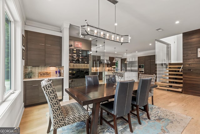 dining room with visible vents, ornamental molding, stairway, recessed lighting, and light wood-style flooring