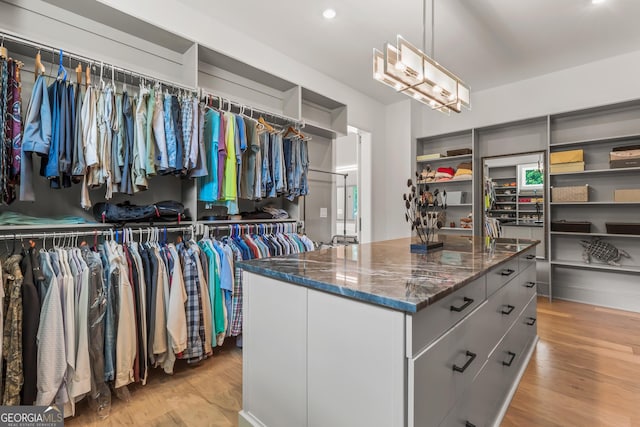spacious closet featuring light wood finished floors