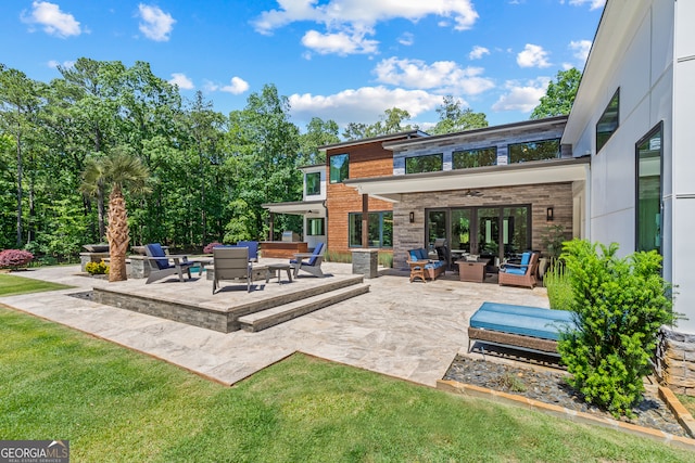 view of patio / terrace featuring an outdoor hangout area, a ceiling fan, and french doors