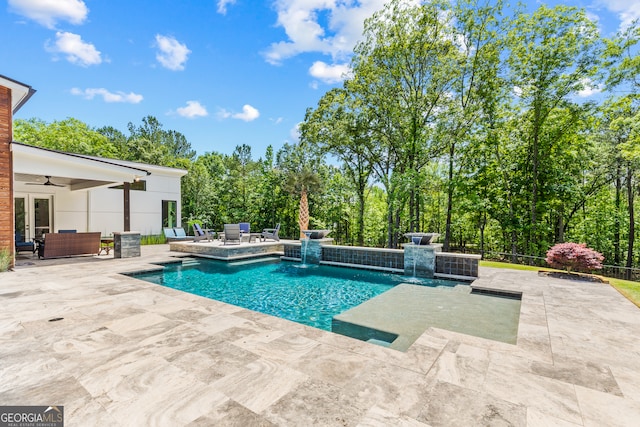 pool featuring a patio, ceiling fan, an outdoor living space, and french doors