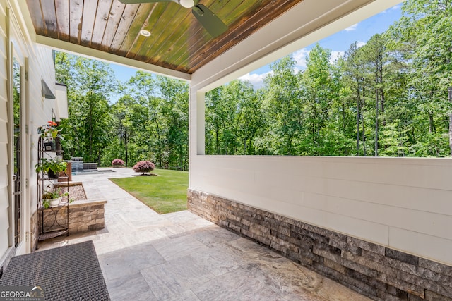 view of patio featuring a ceiling fan