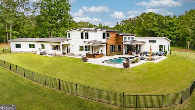 back of property with an outdoor hangout area, a fenced backyard, a patio area, central air condition unit, and a yard