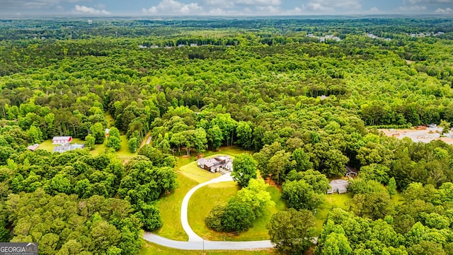 drone / aerial view with a view of trees