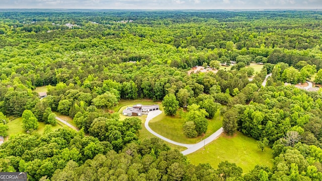 drone / aerial view with a view of trees