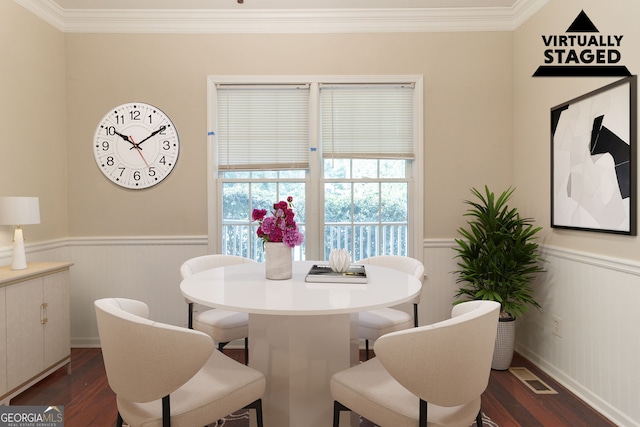 6416 Vicksburg Ct NW, Acworth, GA 30101 - dining area with a wainscoted wall, ornamental molding, and dark wood-style floors