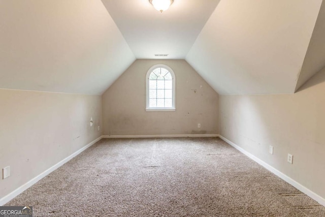 6416 Vicksburg Ct NW, Acworth, GA 30101 - bonus room featuring carpet floors, vaulted ceiling, and baseboards