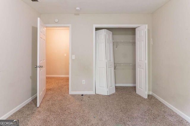 6416 Vicksburg Ct NW, Acworth, GA 30101 - unfurnished bedroom featuring carpet, a closet, and baseboards