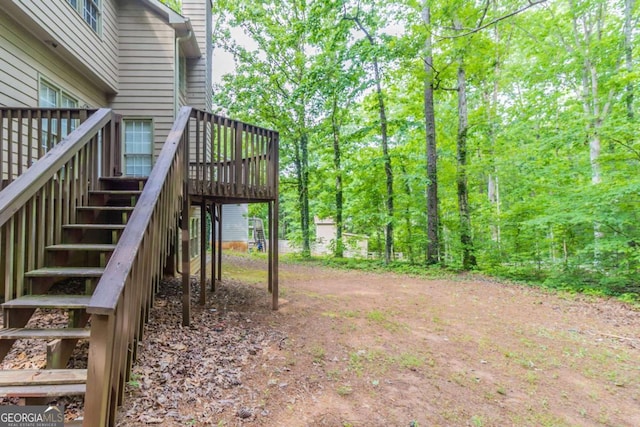 6416 Vicksburg Ct NW, Acworth, GA 30101 - view of yard with stairs, a deck, and dirt driveway