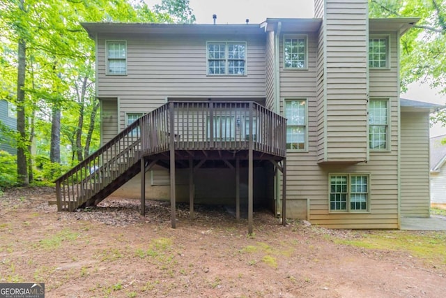 6416 Vicksburg Ct NW, Acworth, GA 30101 - back of property with stairway, a wooden deck, and a chimney