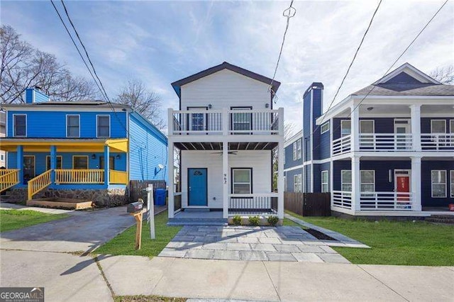 962 Welch St SW, Atlanta, GA 30310 - view of front facade featuring covered porch, a front yard, and a balcony