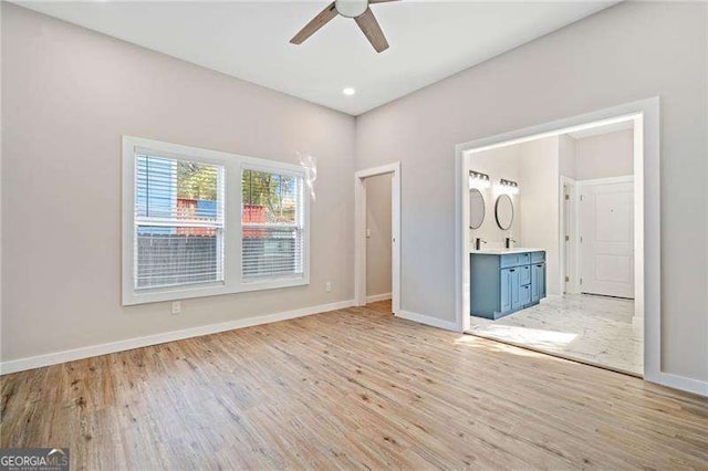 962 Welch St SW, Atlanta, GA 30310 - unfurnished bedroom with light wood-style floors, connected bathroom, baseboards, and ceiling fan