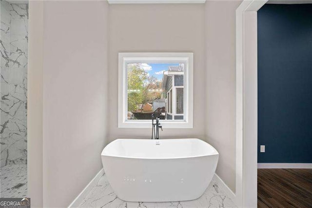 962 Welch St SW, Atlanta, GA 30310 - full bath featuring a freestanding bath, baseboards, walk in shower, and marble finish floor
