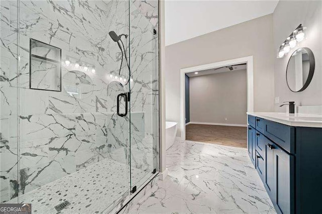 962 Welch St SW, Atlanta, GA 30310 - bathroom featuring a freestanding bath, baseboards, vanity, marble finish floor, and a marble finish shower