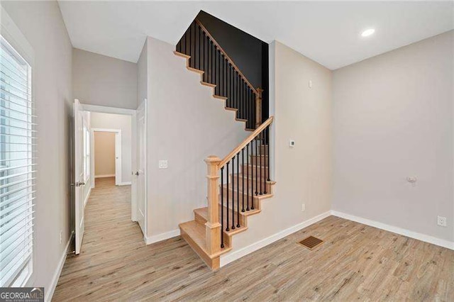 962 Welch St SW, Atlanta, GA 30310 - stairs featuring baseboards, recessed lighting, wood finished floors, and visible vents