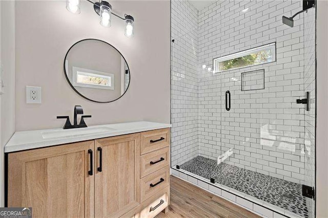 962 Welch St SW, Atlanta, GA 30310 - bathroom with vanity, wood finished floors, and a shower stall