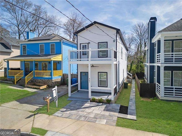 962 Welch St SW, Atlanta, GA 30310 - view of front facade featuring a porch, a balcony, and a front yard