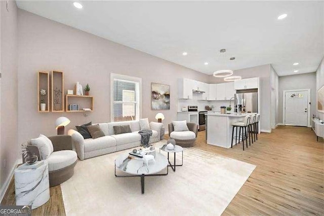 962 Welch St SW, Atlanta, GA 30310 - living room featuring baseboards, recessed lighting, and light wood-style flooring
