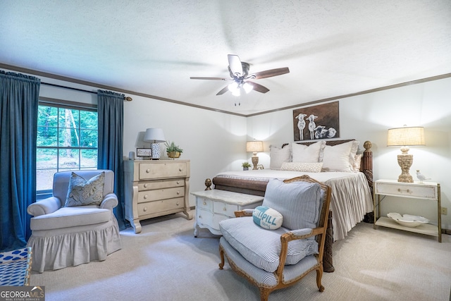 bedroom featuring ornamental molding, carpet, and a textured ceiling