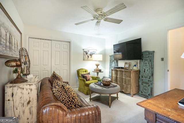 living room featuring ceiling fan and light carpet