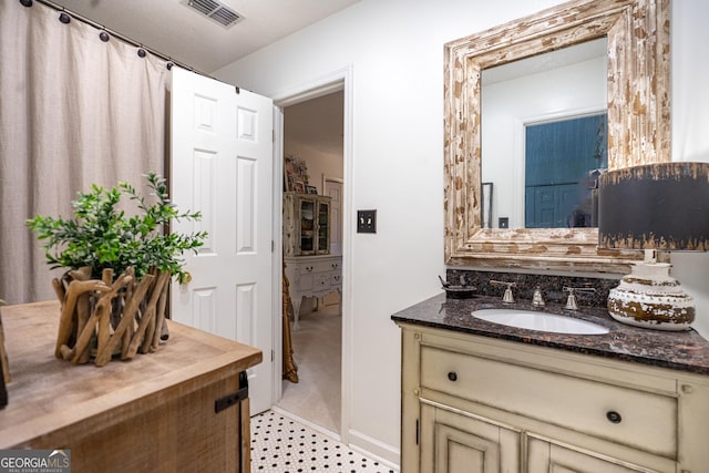 bathroom featuring visible vents and vanity